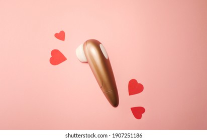 Woman vibrator flat lay banner. Valentines day. Sex toys wallpaper. Pink paper hearts. Copy space 