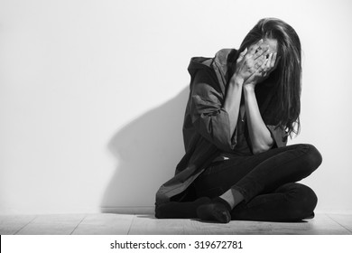 Woman victim of domestic violence and abuse,black and white photo.