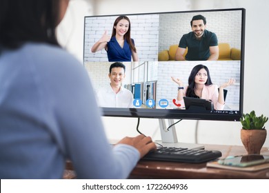 Woman video conference with team on computer,have online briefing or consultation from home,Business team using computer for speak talk on group in video call. Group of people working from home.



