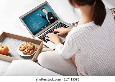 Woman video conferencing with tutor on laptop at home. Distance education concept.