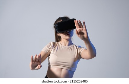 Woman Video Editor Experiencing VR Goggles, Gesturing, Editing Video Film Montage Working With Footage And Sound In A Studio With Neon Light. Videographer Processing Movie In Creative Agency.