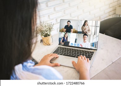 Woman Videoconference With Team On Laptop,have Online Briefing Or Consultation From Home,Business Team Using Laptop For Speak Talk On Group In Video Call. Group Of People Working From Home.