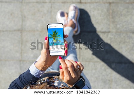 Woman viewing photos on her phone
