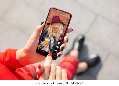 Woman viewing social media content on mobile phone