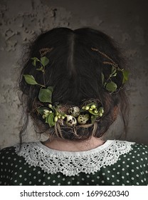 Woman In Vintage Dress With Lace Collar And Hairstyle Decorated As Bird Nest