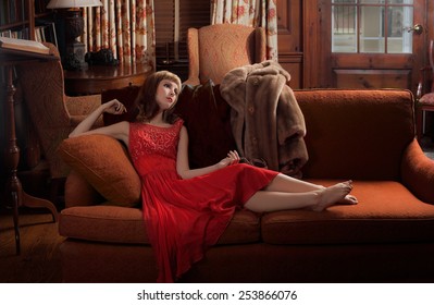 Woman In Vintage Styling on Couch