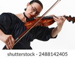 Woman, violin player performs a complex composition, engaging deeply with the music isolated on white background. Concept of music, festival, concert, hobby, talent, performance