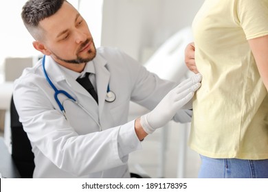 Woman Visiting Gastroenterologist In Clinic