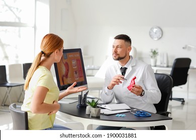 Woman Visiting Gastroenterologist In Clinic