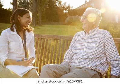 Woman Visiting Senior Male Relative In Assisted Living Facility