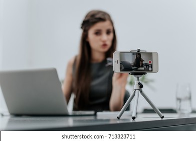 Woman Vlogger Recording Business Vlog At Office Desk