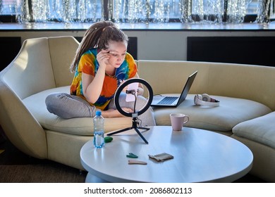 Woman Vlogger Uses Ring Light On Streaming About Makeup.