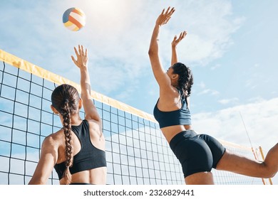 Woman, volleyball and teamwork by net for sports game, match or competition together in the outdoors. Female person, friends or team playing volley reaching for ball in fitness or athletics in nature - Powered by Shutterstock