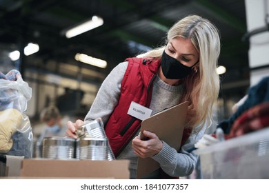 Woman Volunteer In Community Charity Donation Center, Food Bank And Coronavirus Concept.