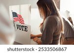 Woman voting at polling station. Us election voting private booth, Voting booth with US flag. Us election day. US election day. Vote for American democracy.