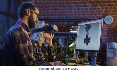 Woman In VR Glasses And Man Sitting At Computer And Creating Graphics Of Modern Video Game