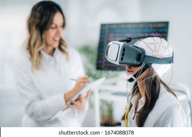 Woman with VR or Virtual Reality Goggles in a Neuroscience Laboratory
