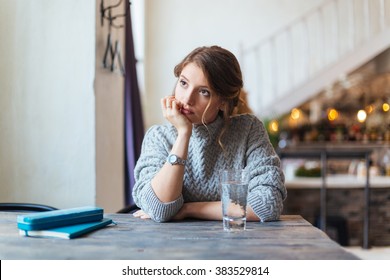 Woman Waiting For Somebody In Cafe