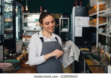 woman waitress polishing wine glass - Powered by Shutterstock