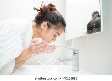 Woman wakes from sleep and she was cleansing the morning before shower - Shutterstock ID 440166898