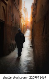 Woman Walking In A Alley In The City Of Marrakesh, Morocco.