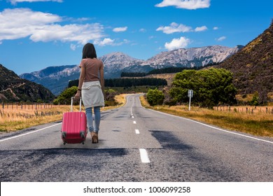 woman walking alone on highway road at countryside without destination, CONCEPT run away home, looking for destination, worry in stay alone, homeless