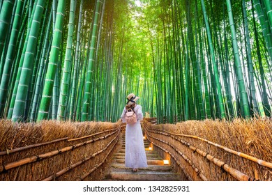 Woman Walking At Bamboo Forest In Kyoto, Japan.