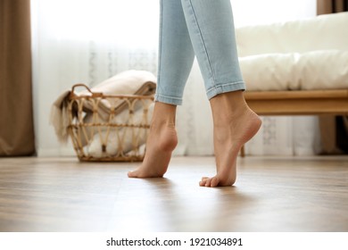 Woman Walking Barefoot At Home, Closeup. Floor Heating Concept