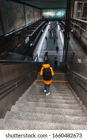 Woman Walking By Stairs Down To Metro Subway Underground Station