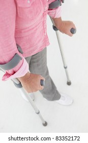 Woman Walking With Crutches