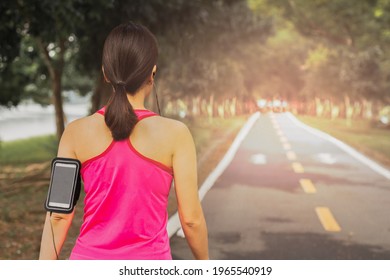 Woman Walking Exercise In The Park Early Morning