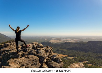 Woman walking in The iconic Pinnacle walk and lookout is one of the highlights of the entire Grampians region. Hikers are rewarded with stunning views of Halls Gap and the Grampians' many peaks.