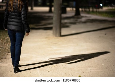 Woman Walking At Night