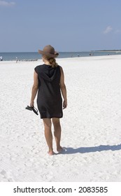 Woman Walking On Beach