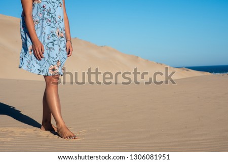 Woman walking on beach during summer