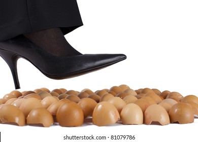 Woman Walking On Egg Shells In High Heels, White Background.