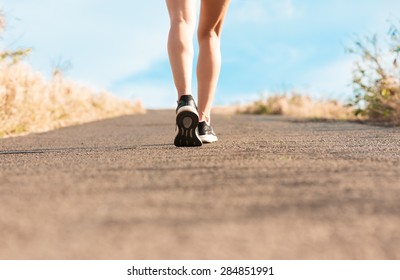 Woman Walking On A Path. (Fitness Concept) 