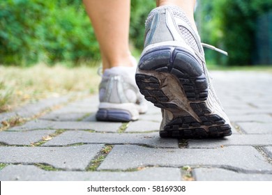 Woman Walking On Sidewalk, Sport Shoes Closeup