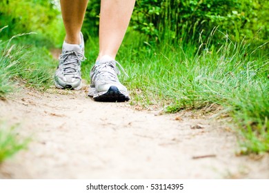 Woman Walking On Trail Path On Meadow Or Forest. Jogging Or Training Outside In Summer Nature, Motivational Health And Fitness Concept.