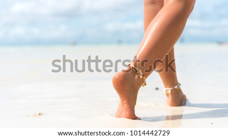 Woman walking on white sand beach in Boracay, Philippines. Beach travel