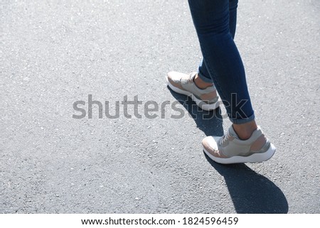 Woman walking outdoors, closeup with space for text. Choosing way concept.
