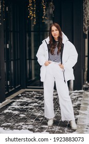 Woman Walking Outside The Street In A Winter Jacket