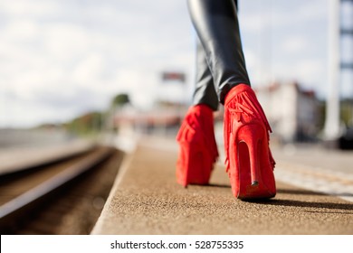 Woman Walking In Red High Heels