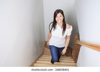 Woman Walking Up Stairs