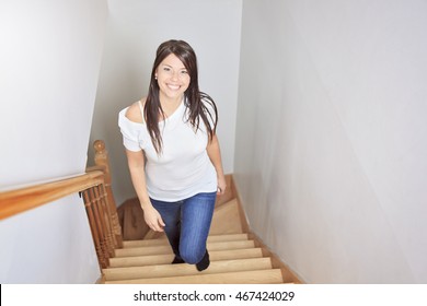 Woman Walking Up Stairs