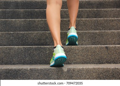 Woman walking up the stairs, Fitness woman legs running and burn fat in the body, Healthy lifestyle concept