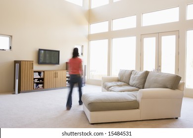 Woman Walking Through Living Room