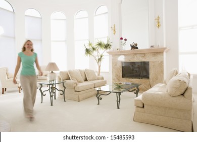 Woman Walking Through Living Room