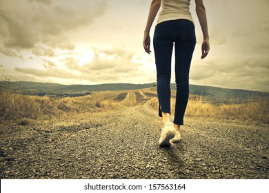 woman walking towards unknown places