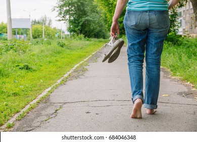 Woman Walks Barefoot Along Asphalt RoadẢnh có sẵn Shutterstock